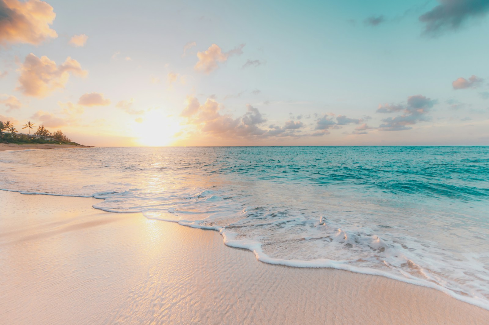 Soft waves meeting a sandy beach